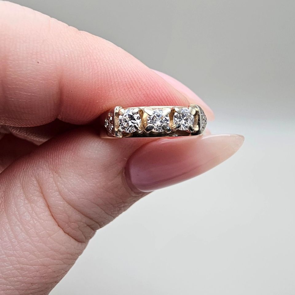 14k gold ring with 3 brilliant cut diamonds and 6 single cut diamonds, totaling 0.40ct.