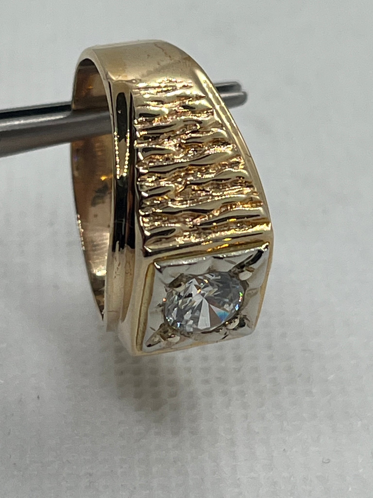 Men’s 10k 6.67 gram Ring set with a one carat blinging C/Z size 10.25  $550.00