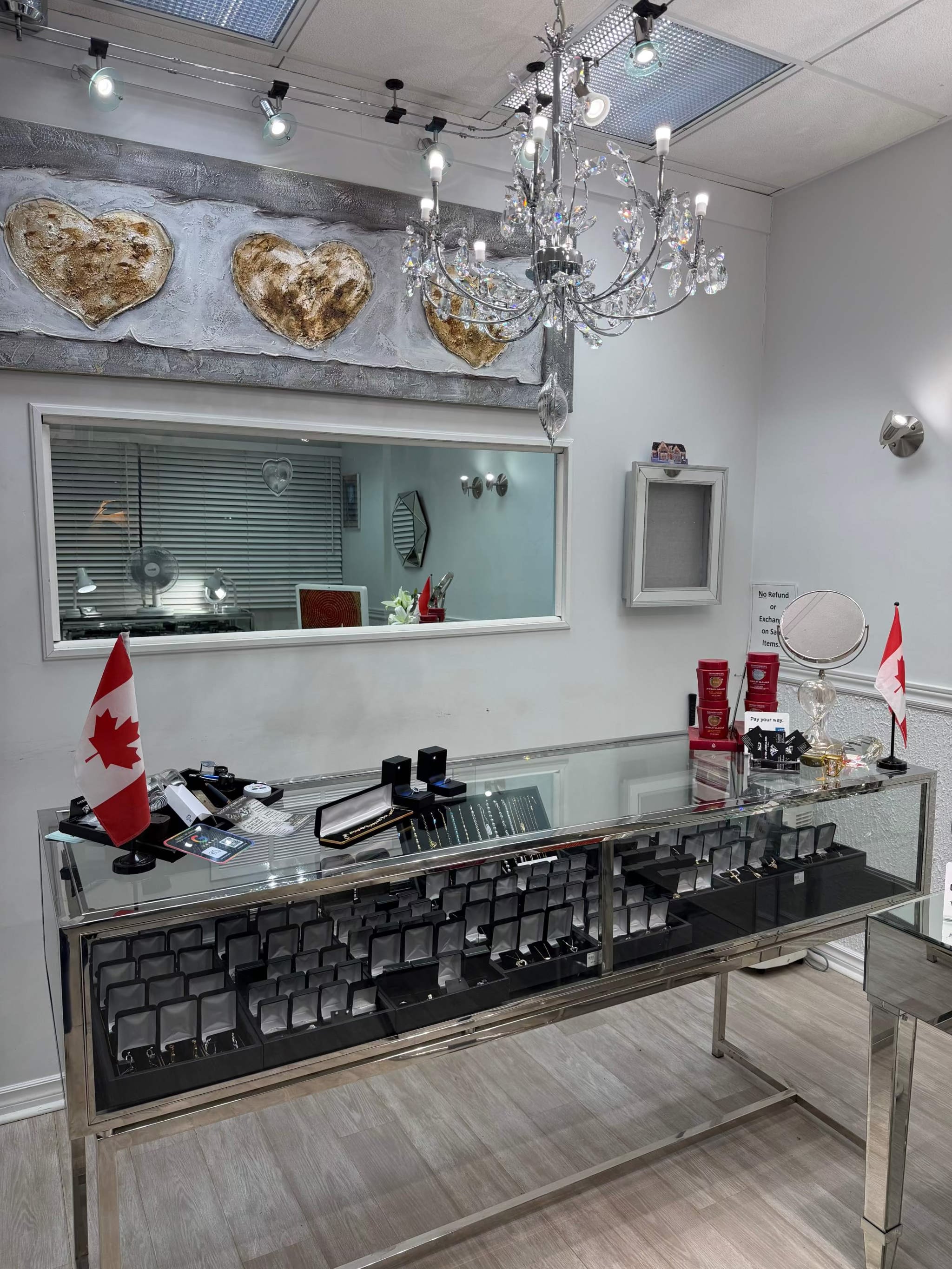 Display case with various items including a chandelier, Canadian flags, and decorative objects in a room.