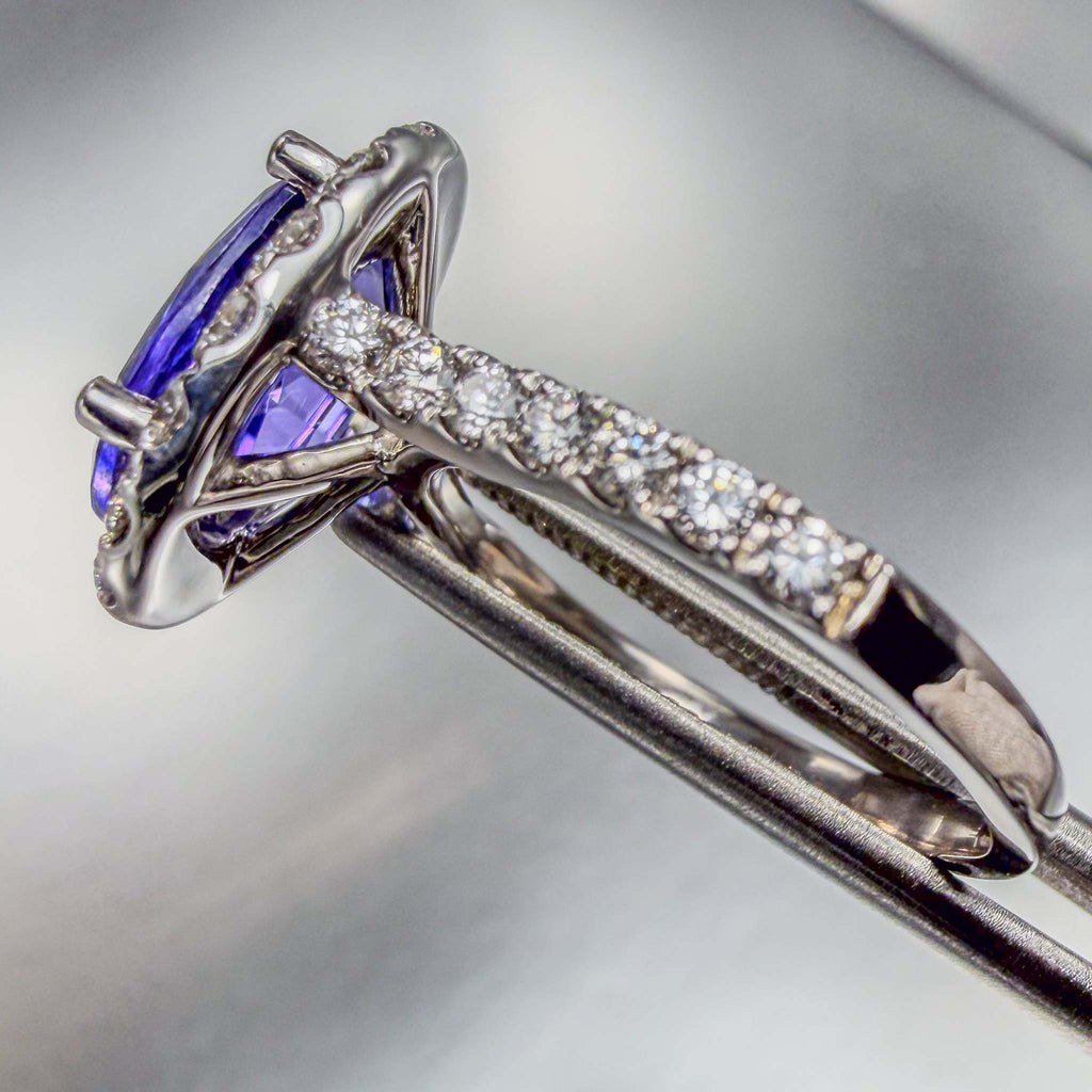 Close up side-view of a pavé diamond white gold ring with bright polish finish  | by Custom Jewellers by Gianni