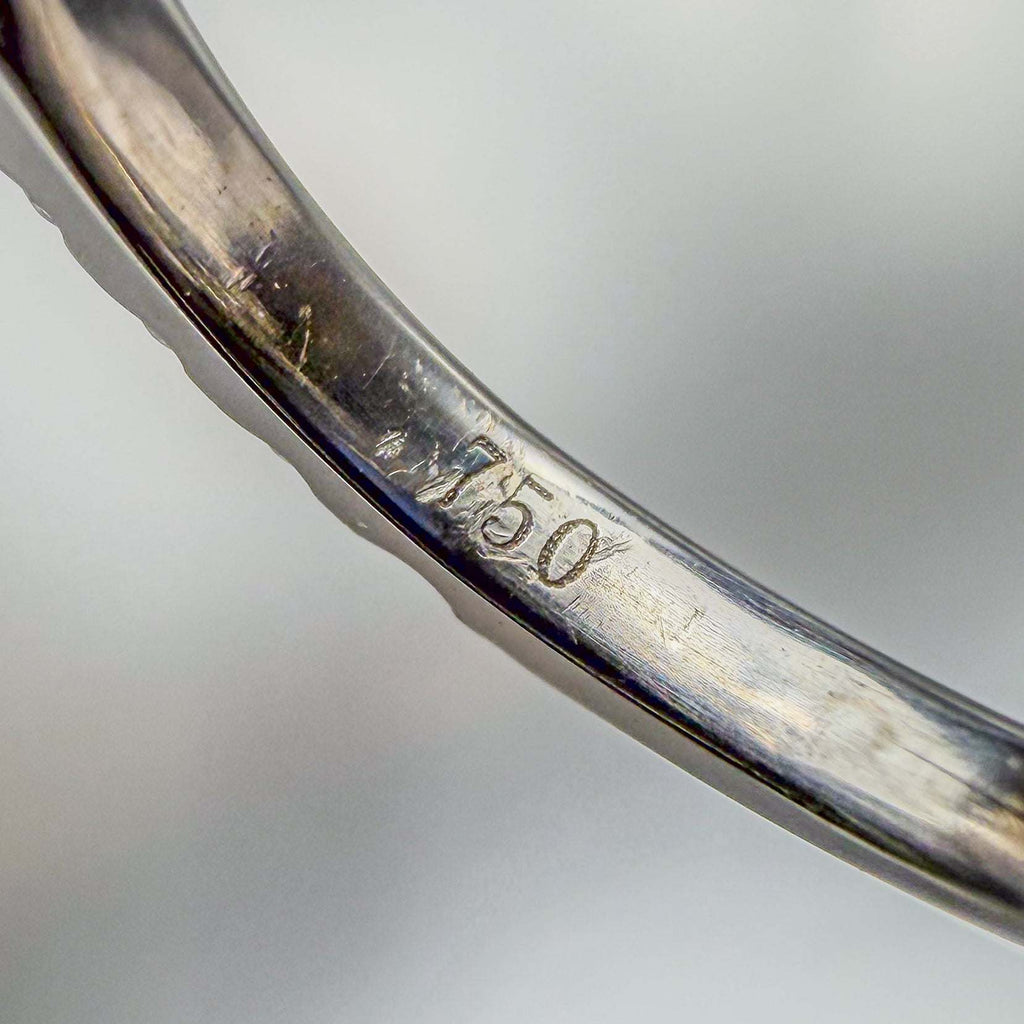 Close-up of a white gold ring with '750' stamp  | by Custom Jewellers by Gianni