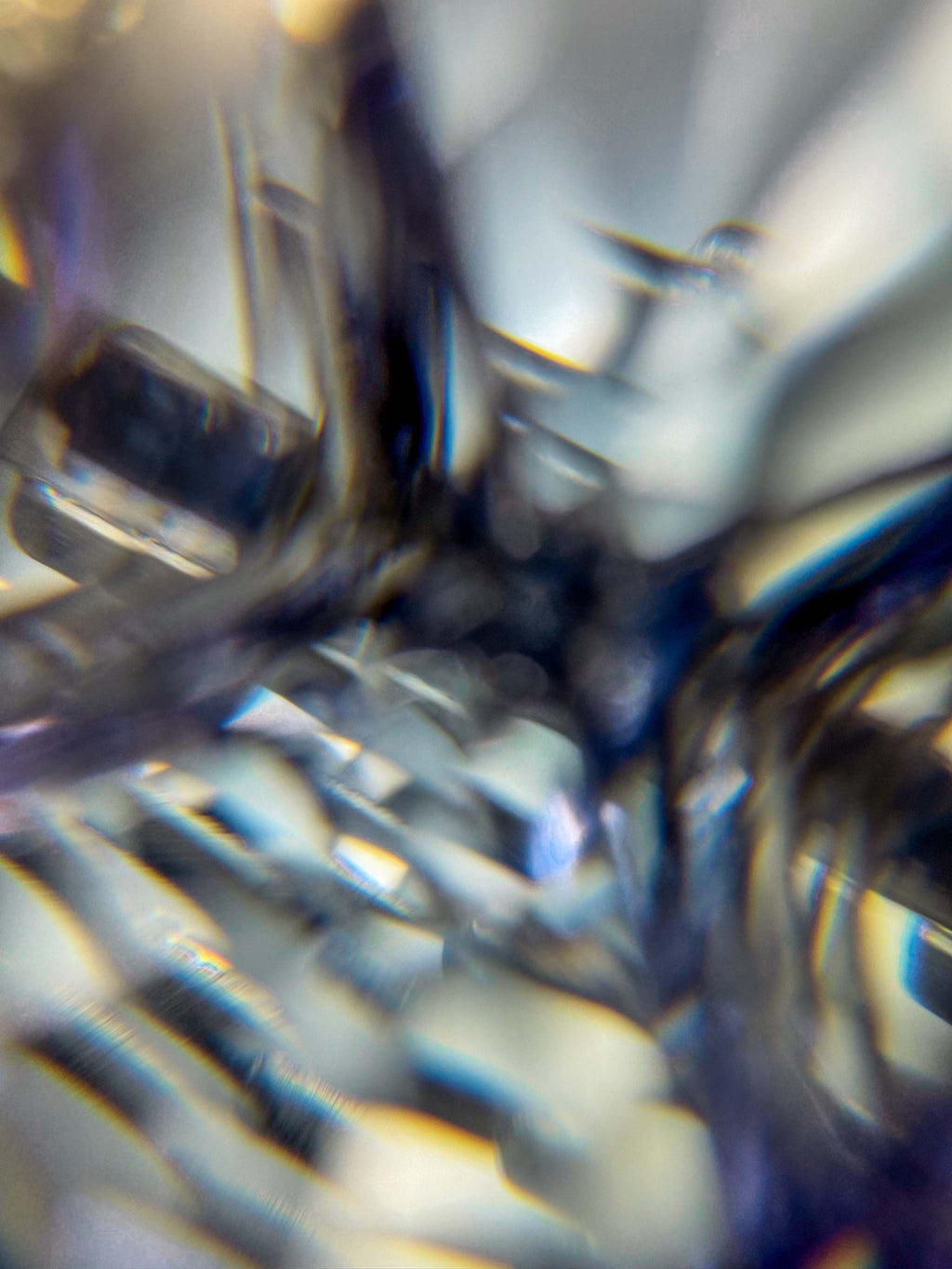 Abstract close-up of Tanzanite Gemstone set in white gold ring | by Custom Jewellers by Gianni