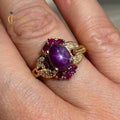 Star Ruby 14k yellow gold dress ring with cabochon star ruby, diamonds, and rubies