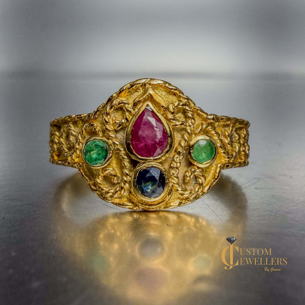 18k yellow gold artisanal vintage-style ring with ruby, sapphire, and emerald gemstones