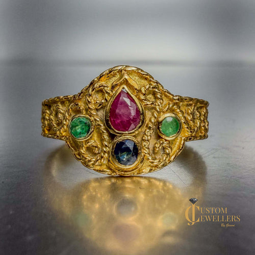 18k yellow gold artisanal vintage-style ring with ruby, sapphire, and emerald gemstones