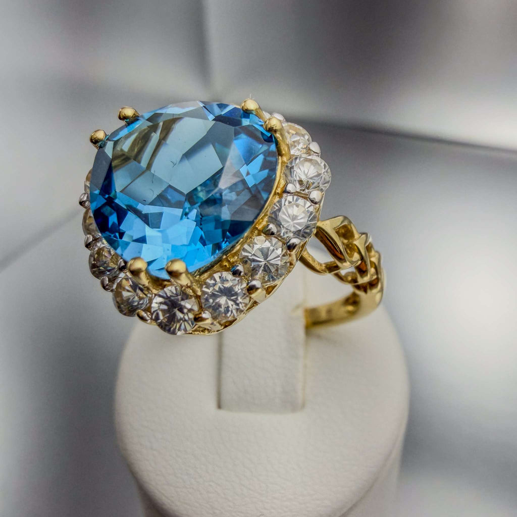 14k yellow gold hand-finished cocktail ring with Mediterranean blue simulant and triple-heart motif