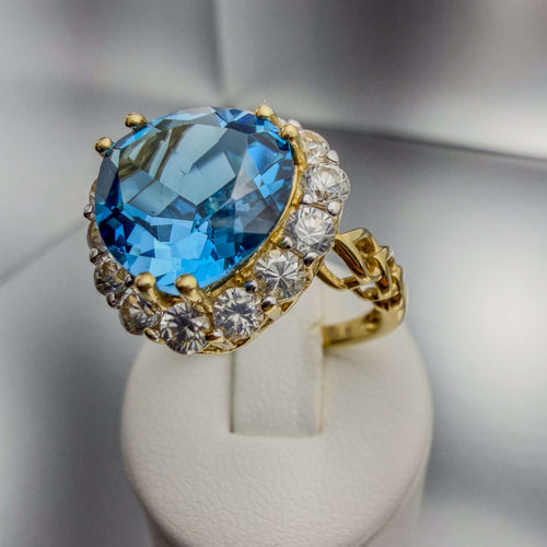 14k yellow gold hand-finished cocktail ring with Mediterranean blue simulant and triple-heart motif