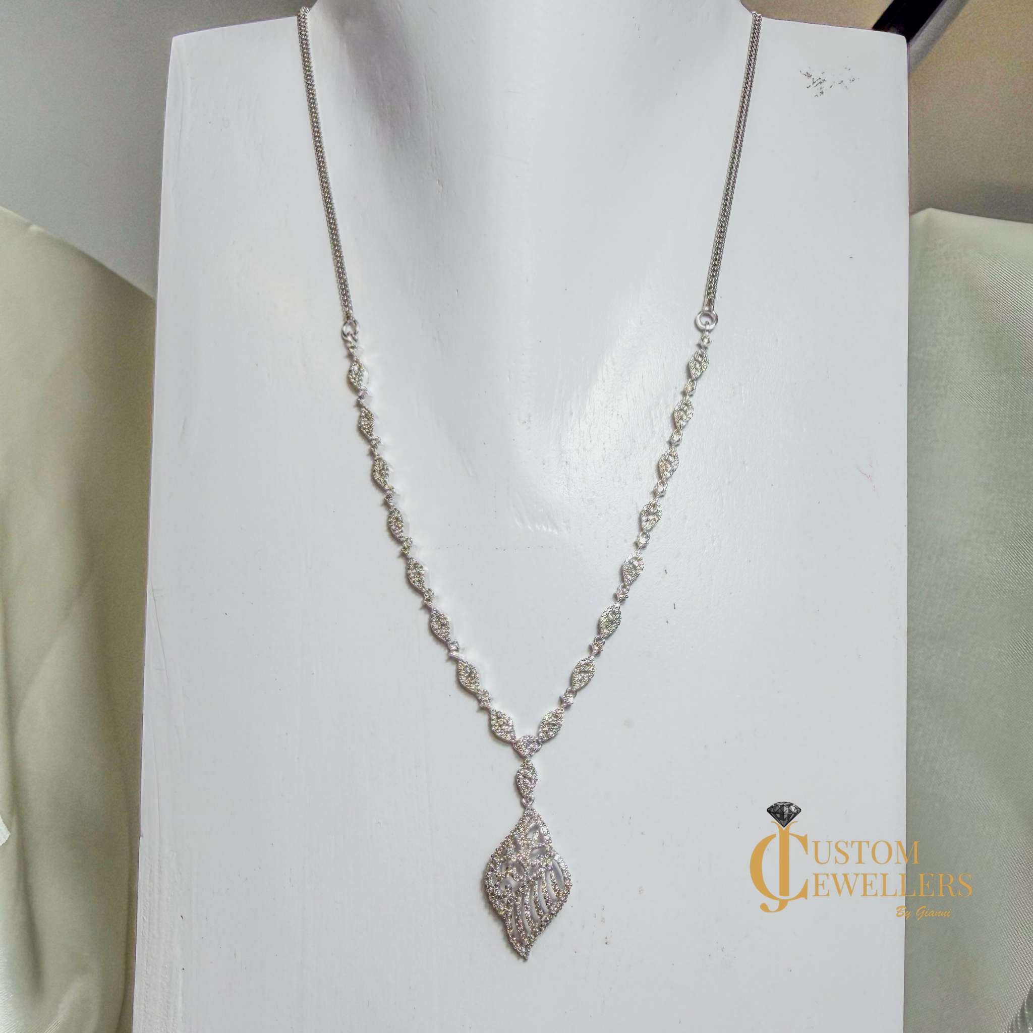 Angel Wing Earrings and Necklace featuring over 600 Natural Diamonds