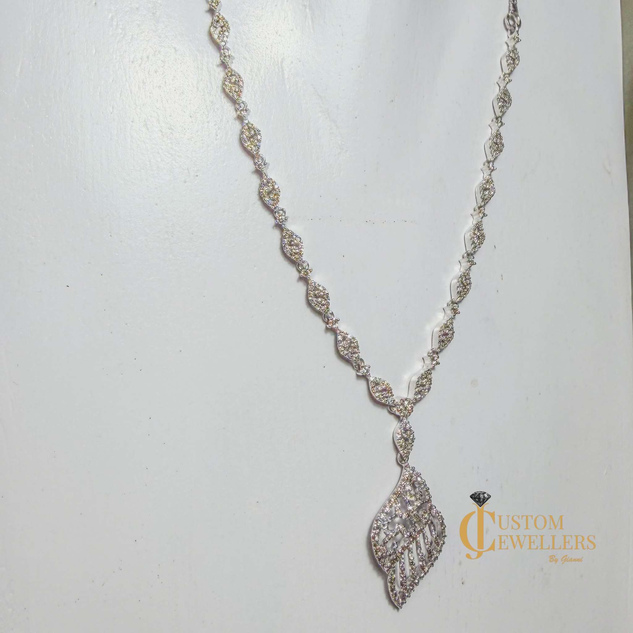 Angel Wing Earrings and Necklace featuring over 600 Natural Diamonds