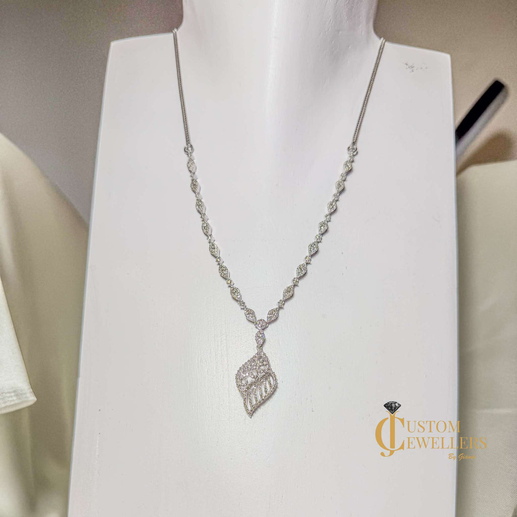 Angel Wing Earrings and Necklace featuring over 600 Natural Diamonds