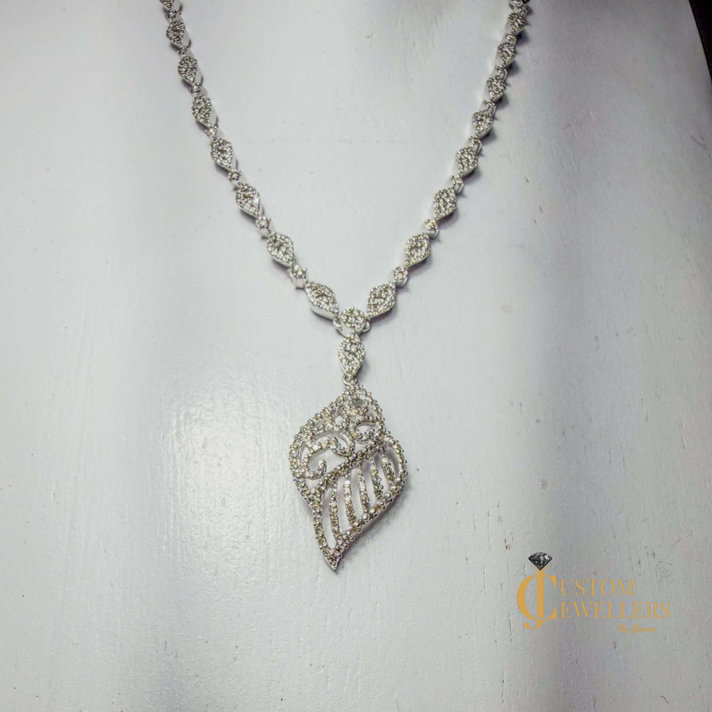Angel Wing Earrings and Necklace featuring over 600 Natural Diamonds
