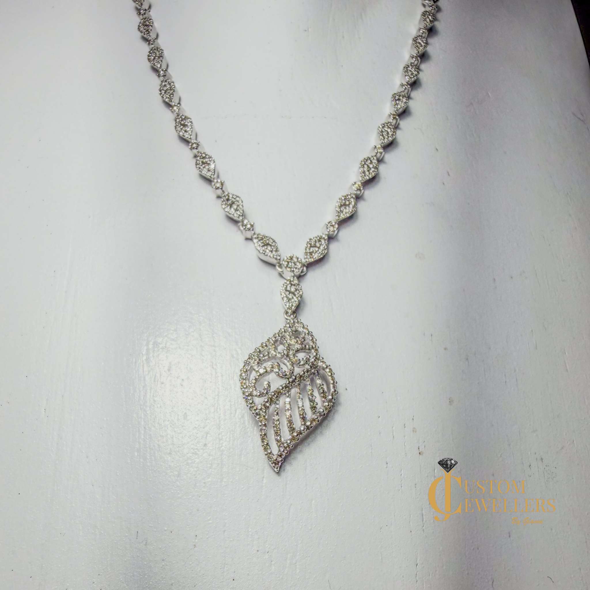 Angel Wing Earrings and Necklace featuring over 600 Natural Diamonds