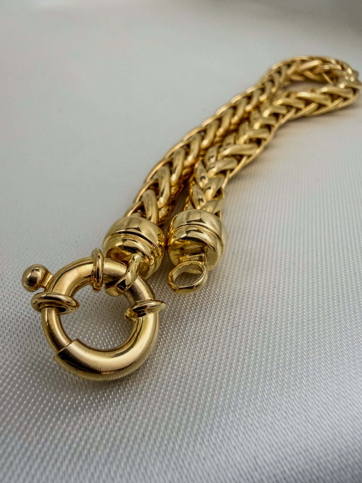 Thick Italy 14k Spiga Woven Chain Link Handmade Bracelet in yellow gold with chunky woven V-link design and round spring clasp closure.