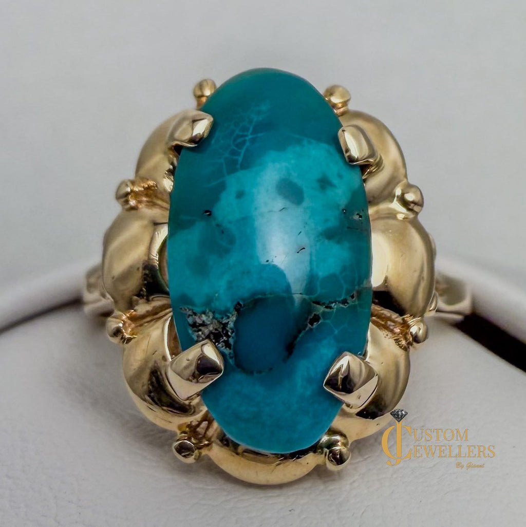 Stunning turquoise stone set in polished 14k yellow gold statement ring