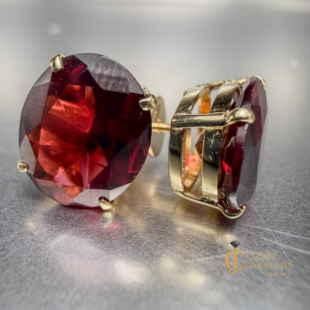 Gorgeous 9ct ruby stud earrings set in 14k yellow gold with oval faceted lab-grown rubies