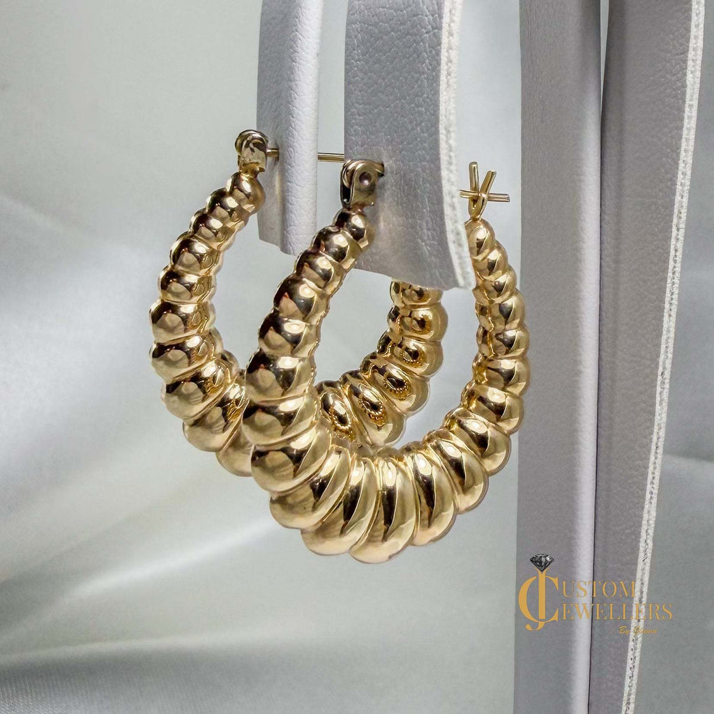 Seashell-inspired gold hoop earrings