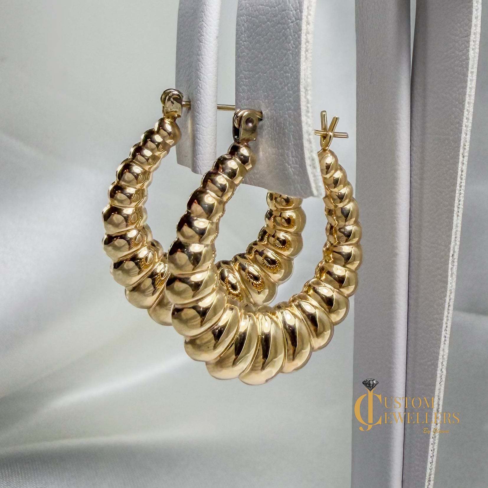 Seashell-inspired gold hoop earrings