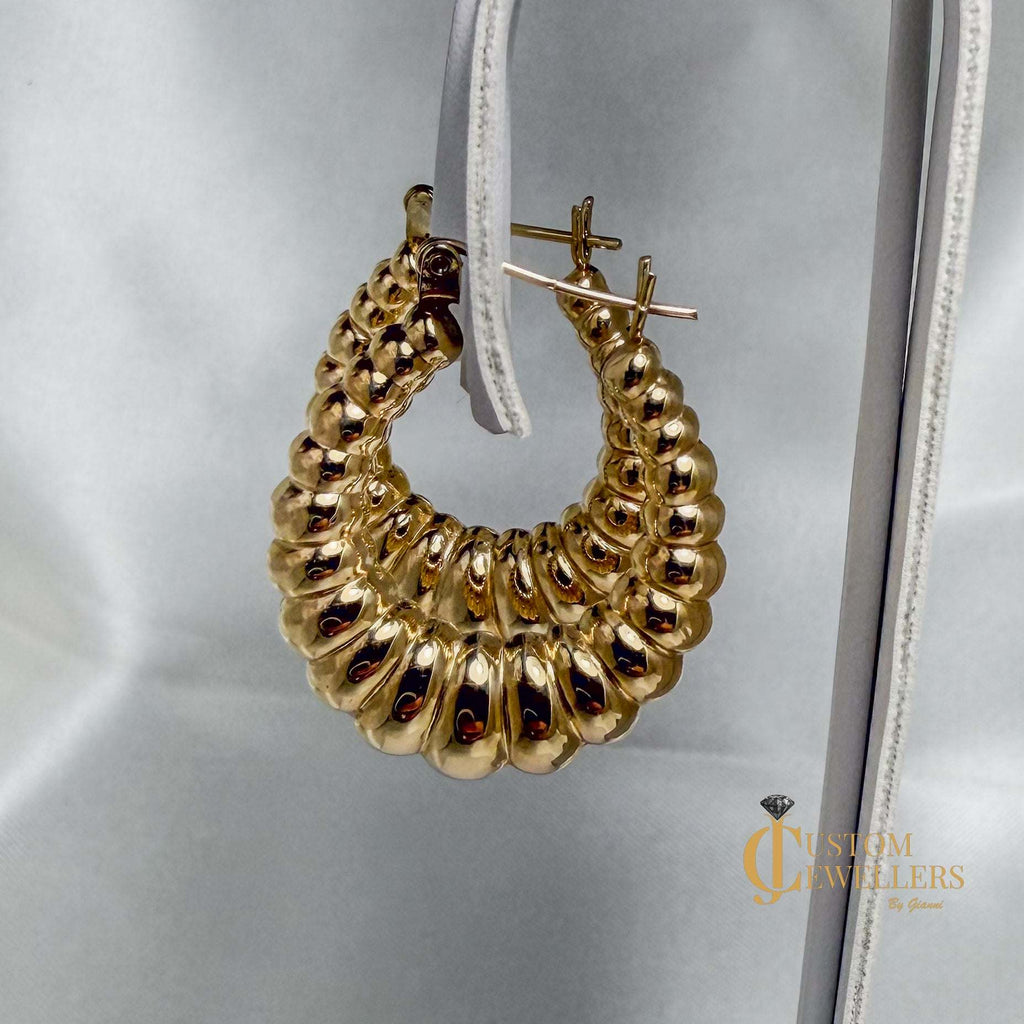 Seashell-inspired gold hoop earrings