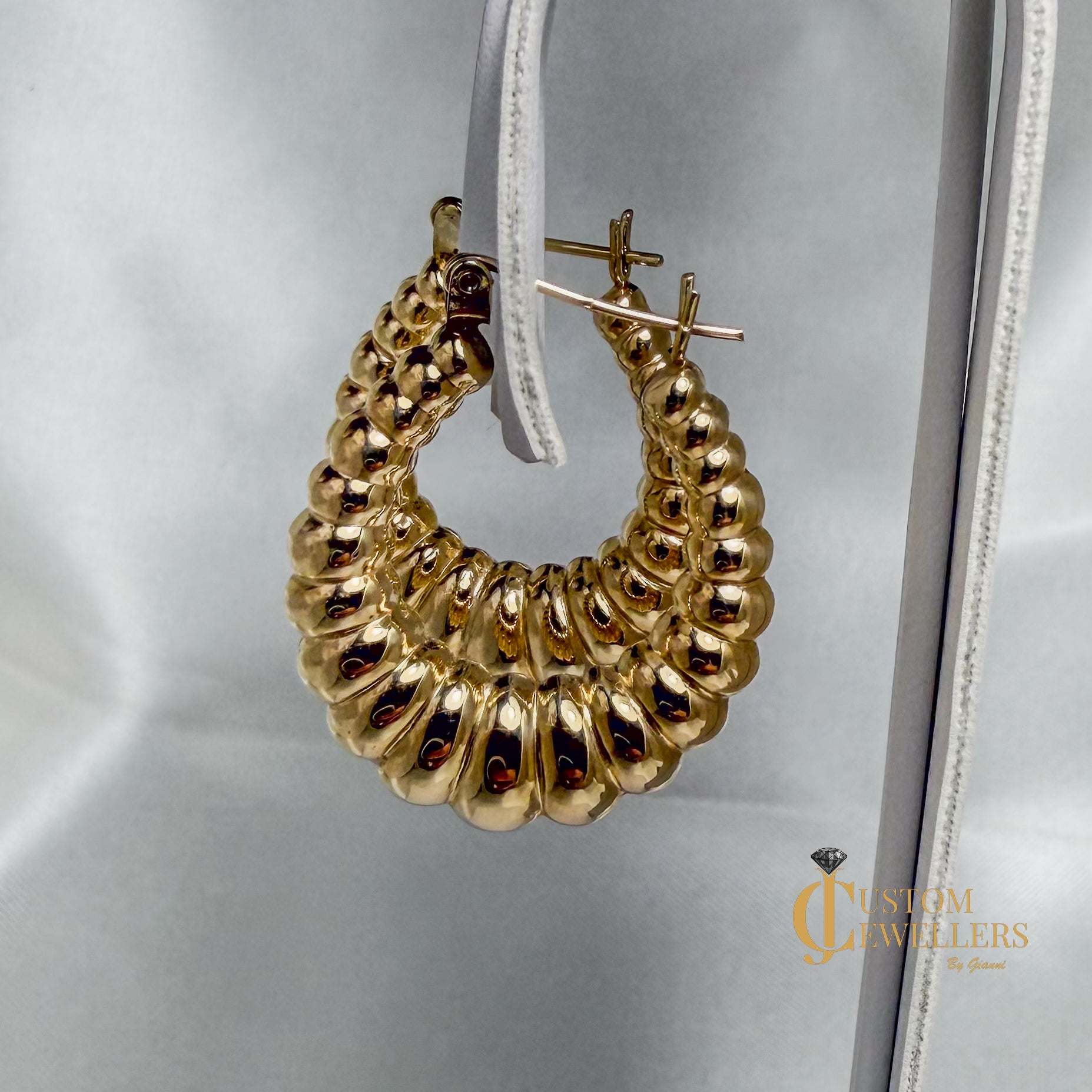 Seashell-inspired gold hoop earrings