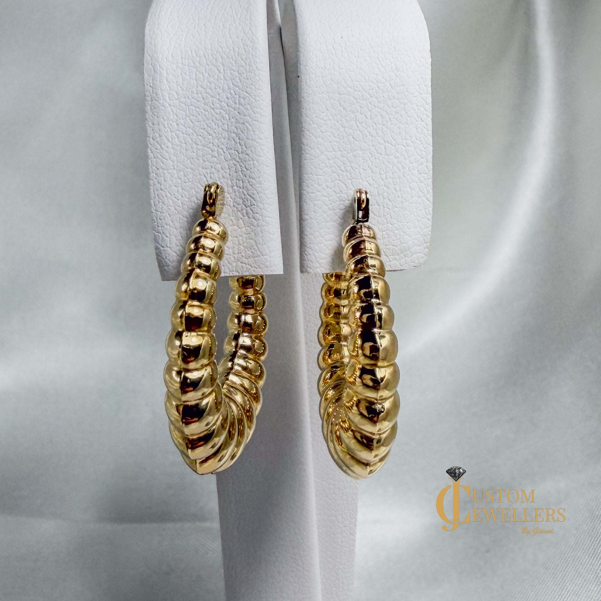 Seashell-inspired gold hoop earrings