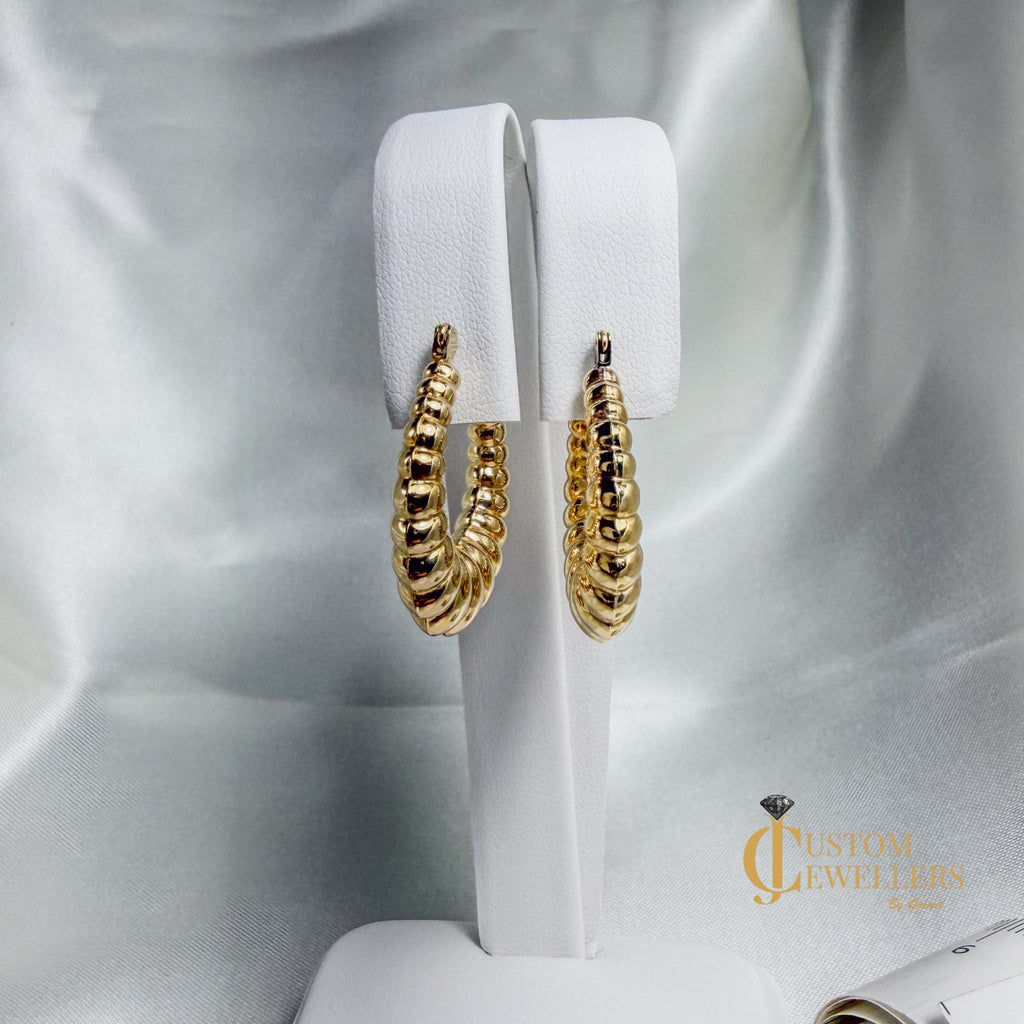 Seashell-inspired gold hoop earrings