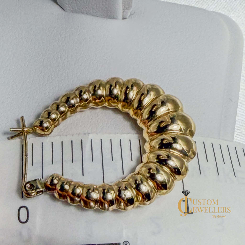 Seashell-inspired gold hoop earrings