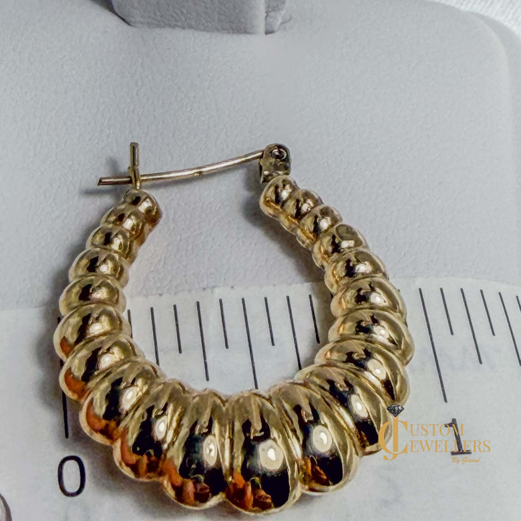 Seashell-inspired gold hoop earrings