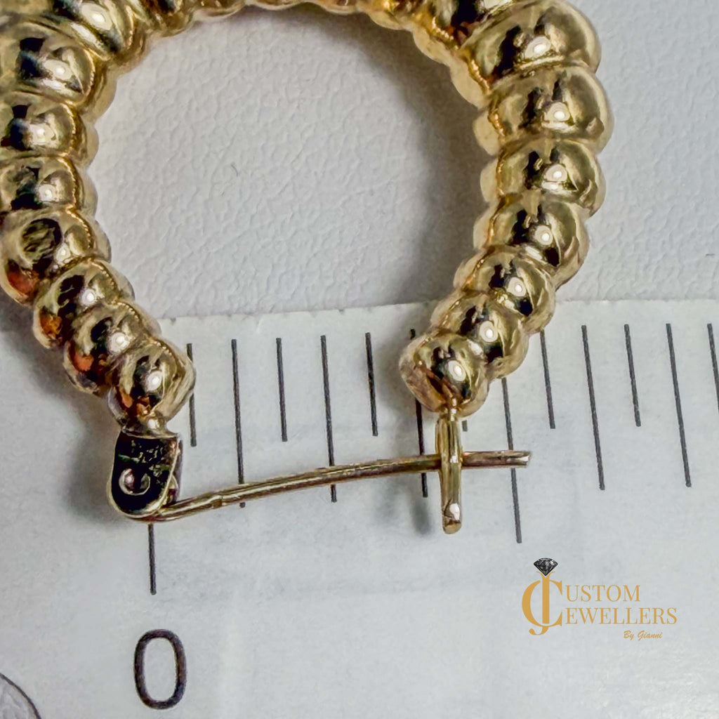 Seashell-inspired gold hoop earrings