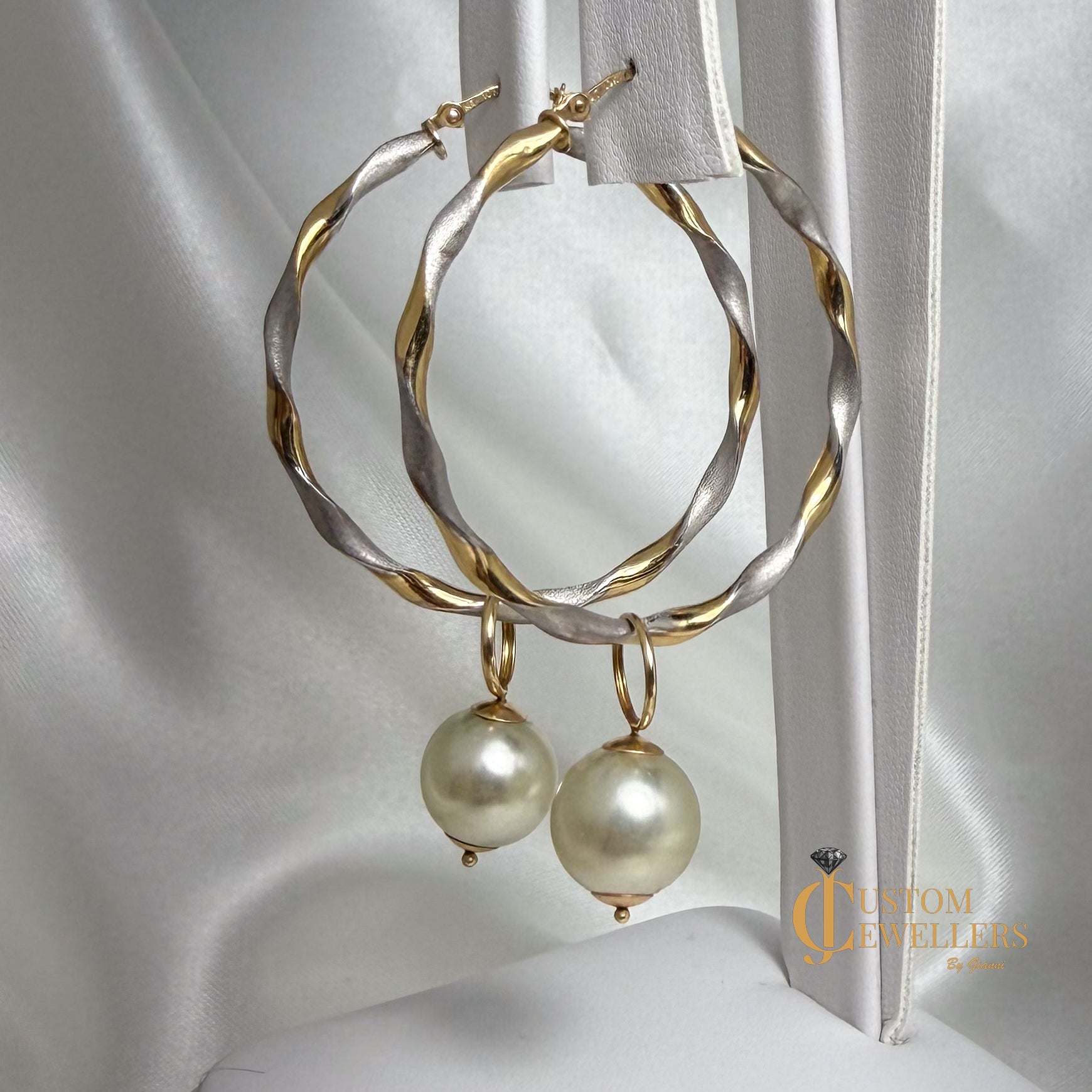 Two-tone two-textured twist hoop earrings with removable synthetic pearls and 10k snap-bar closures