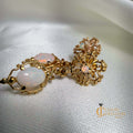 Natural opal floral filigree earrings in 14kt yellow gold with iridescent dangling opals