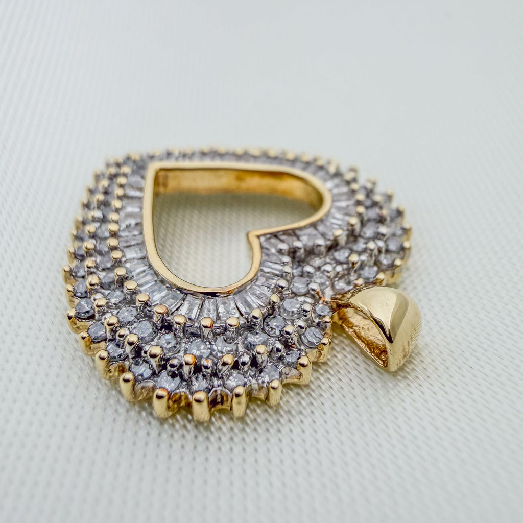 Heart-shaped pendant with 100+ Sparkling Diamonds in silver-tone settings, gold edging, and a two-tone gold bail.