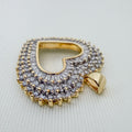 Heart-shaped pendant with 100+ Sparkling Diamonds in silver-tone settings, gold edging, and a two-tone gold bail.