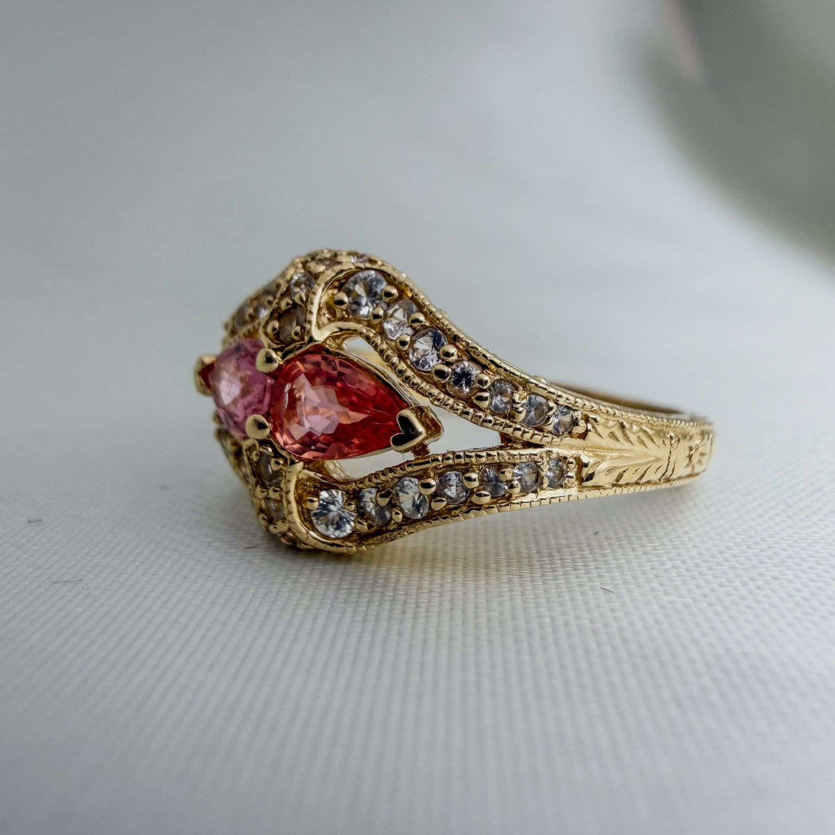 Extremely Rare Padparadscha Sapphires and White Sapphires in an Ornate Hand-Engraved Gold Ring