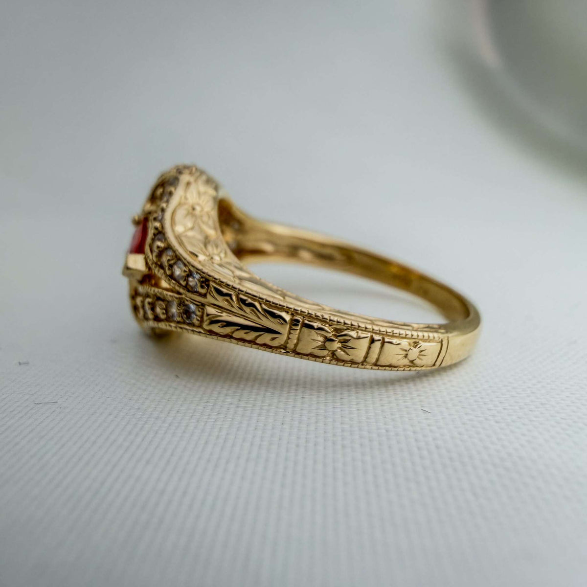 Extremely Rare Padparadscha Sapphires and White Sapphires in an Ornate Hand-Engraved Gold Ring