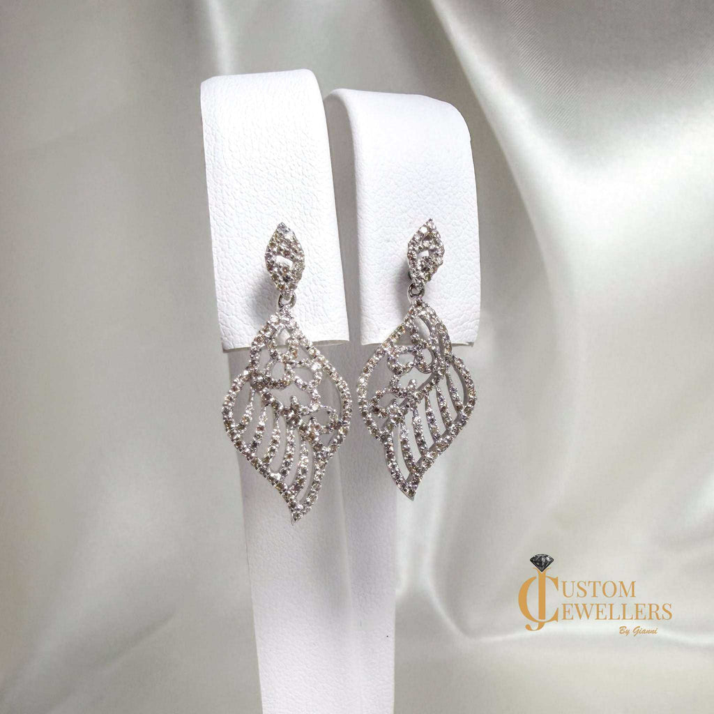 18k white gold angel wing earrings and necklace set with over 600 natural diamonds