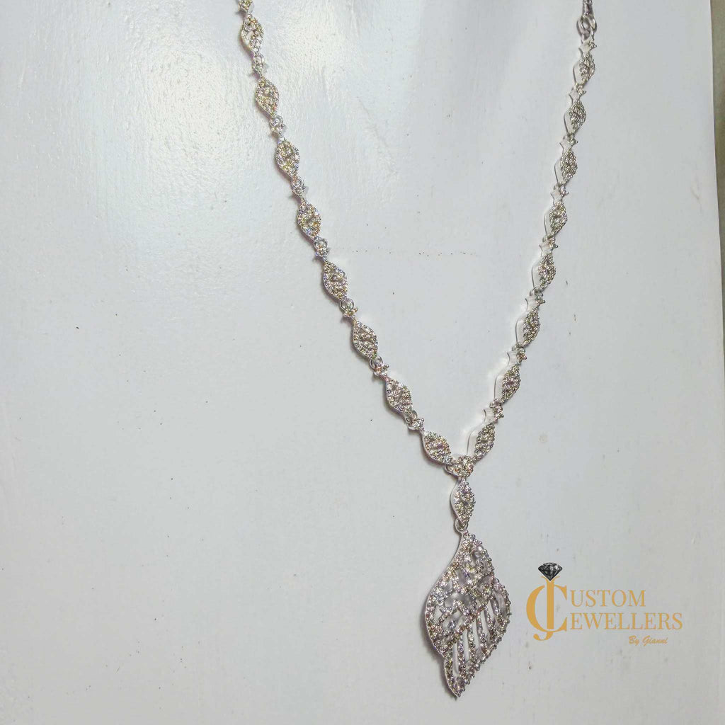 18k white gold angel wing earrings and necklace set with over 600 natural diamonds