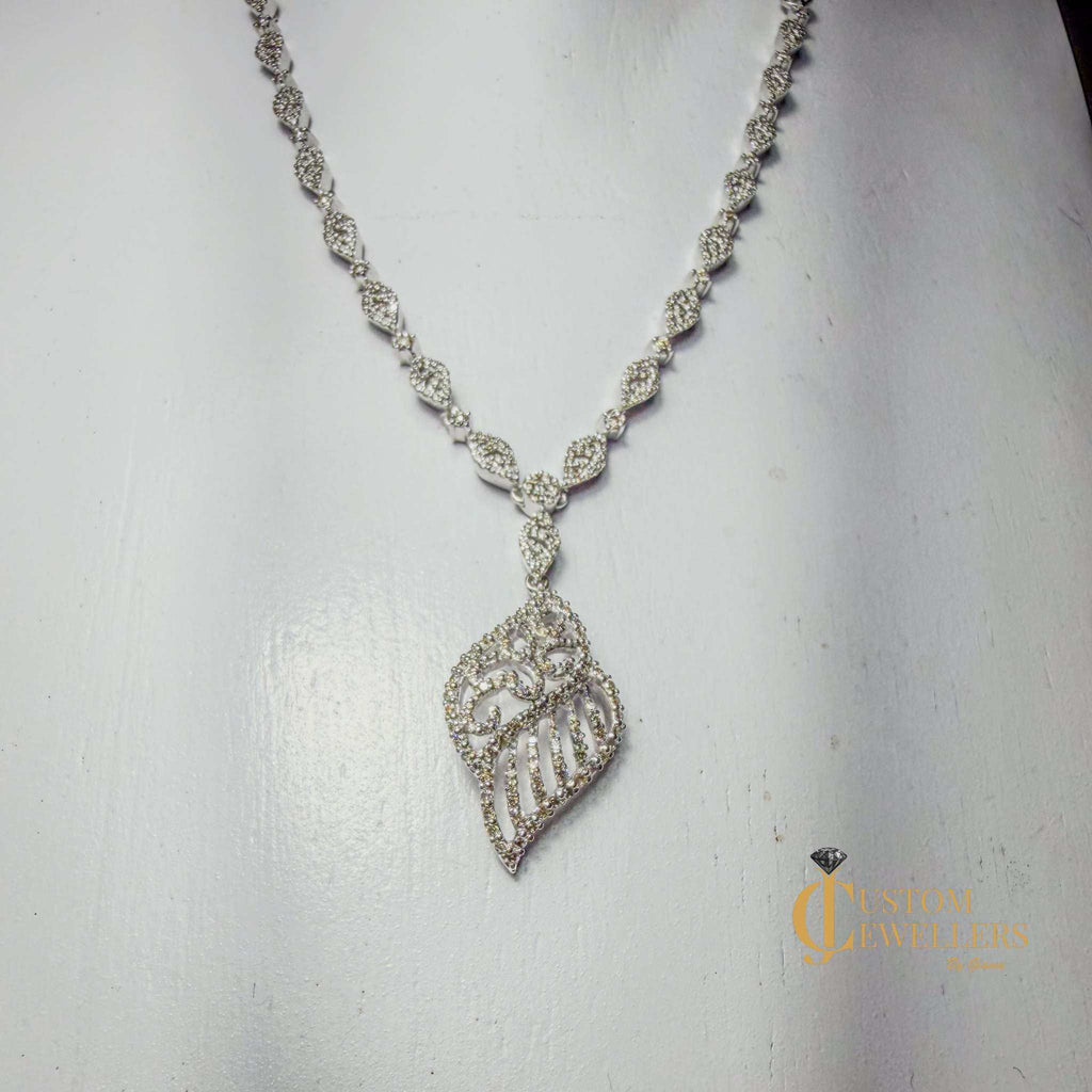 18k white gold angel wing earrings and necklace set with over 600 natural diamonds