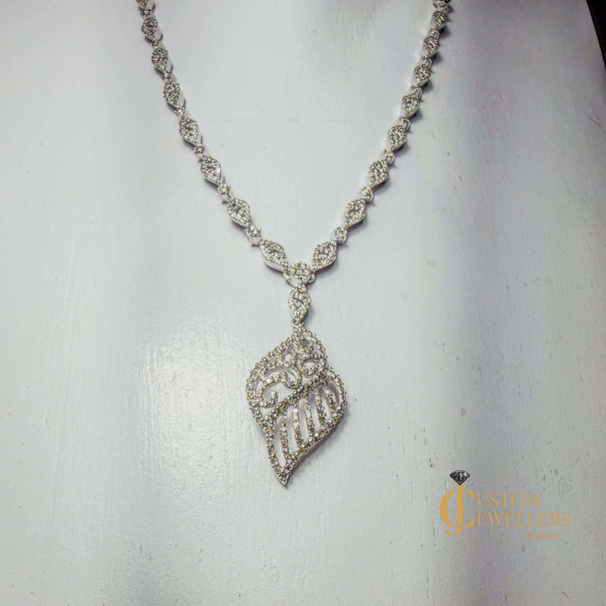 18k white gold angel wing earrings and necklace set with over 600 natural diamonds