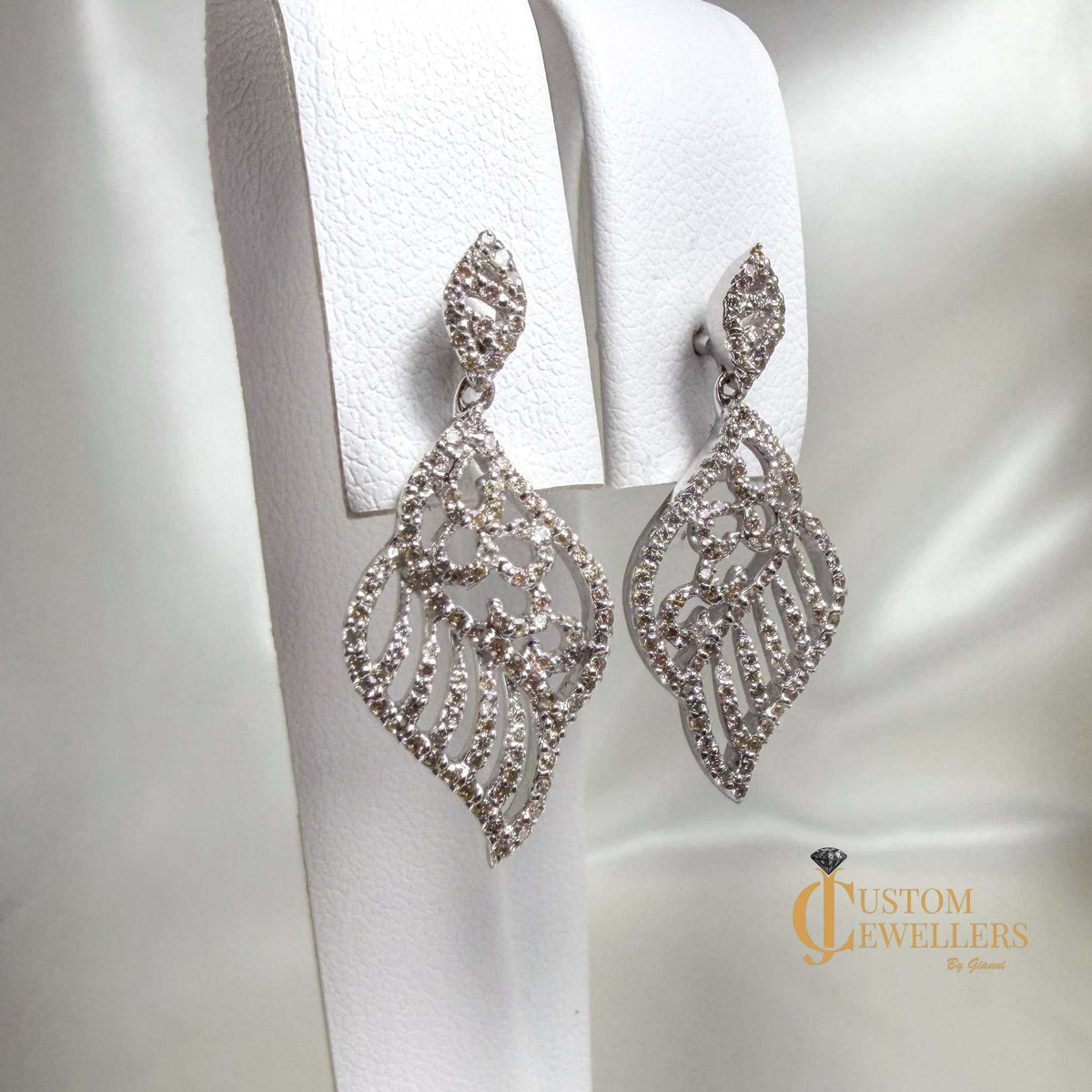 18k white gold angel wing earrings and necklace set with over 600 natural diamonds