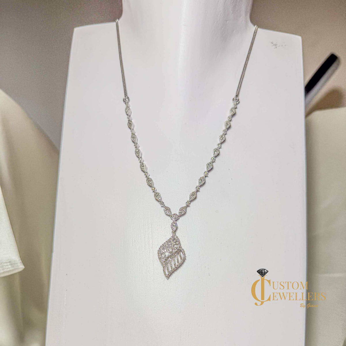 18k white gold angel wing earrings and necklace set with over 600 natural diamonds