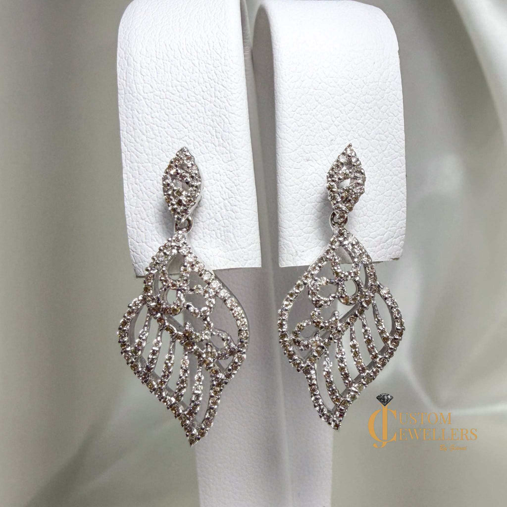 Angel wing earrings and necklace set in 18k white gold with over 600 natural diamonds
