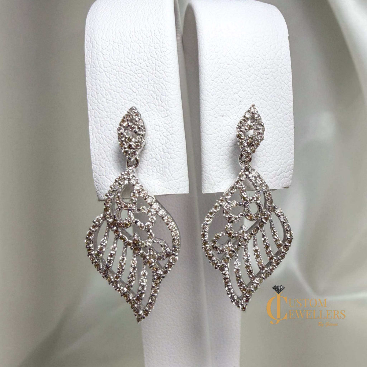 Angel wing earrings and necklace set in 18k white gold with over 600 natural diamonds