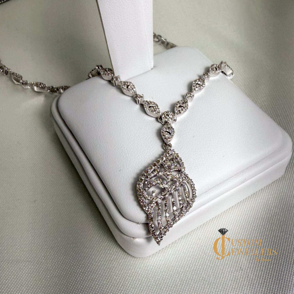 18k white gold angel wing earrings and necklace set with over 600 natural diamonds
