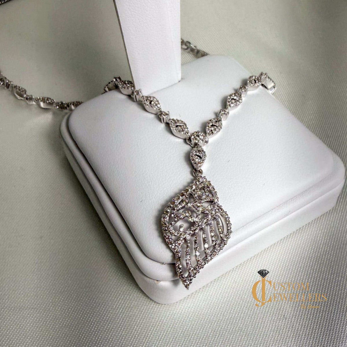 18k white gold angel wing earrings and necklace set with over 600 natural diamonds