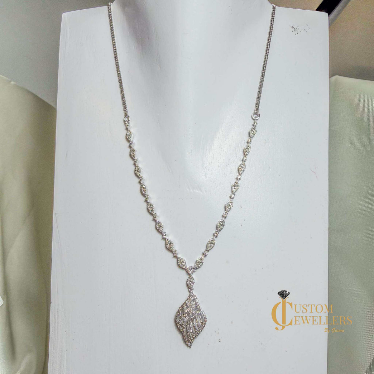 18k white gold angel wing earrings and necklace set with over 600 natural diamonds