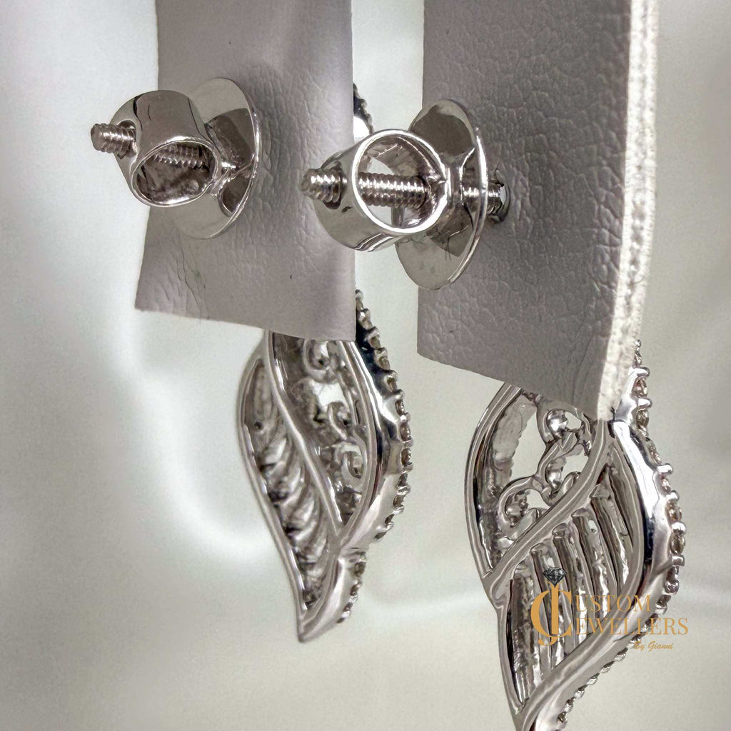 18k white gold angel wing earrings and necklace set with over 600 natural diamonds