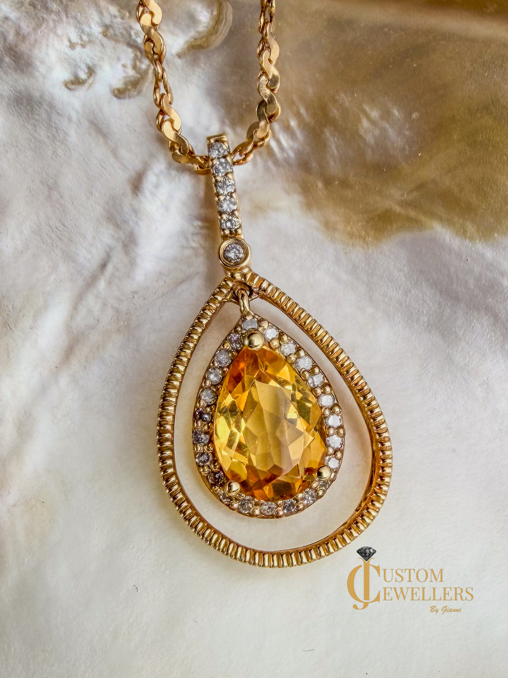 Swinging Teardrop Honey Yellow Citrine Pendant Necklace featuring Diamond Halo Accents in 10kt Yellow Gold Frame