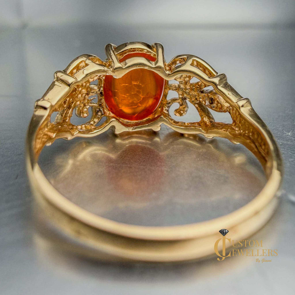 Rare and unique 14k yellow gold orange copal ring
