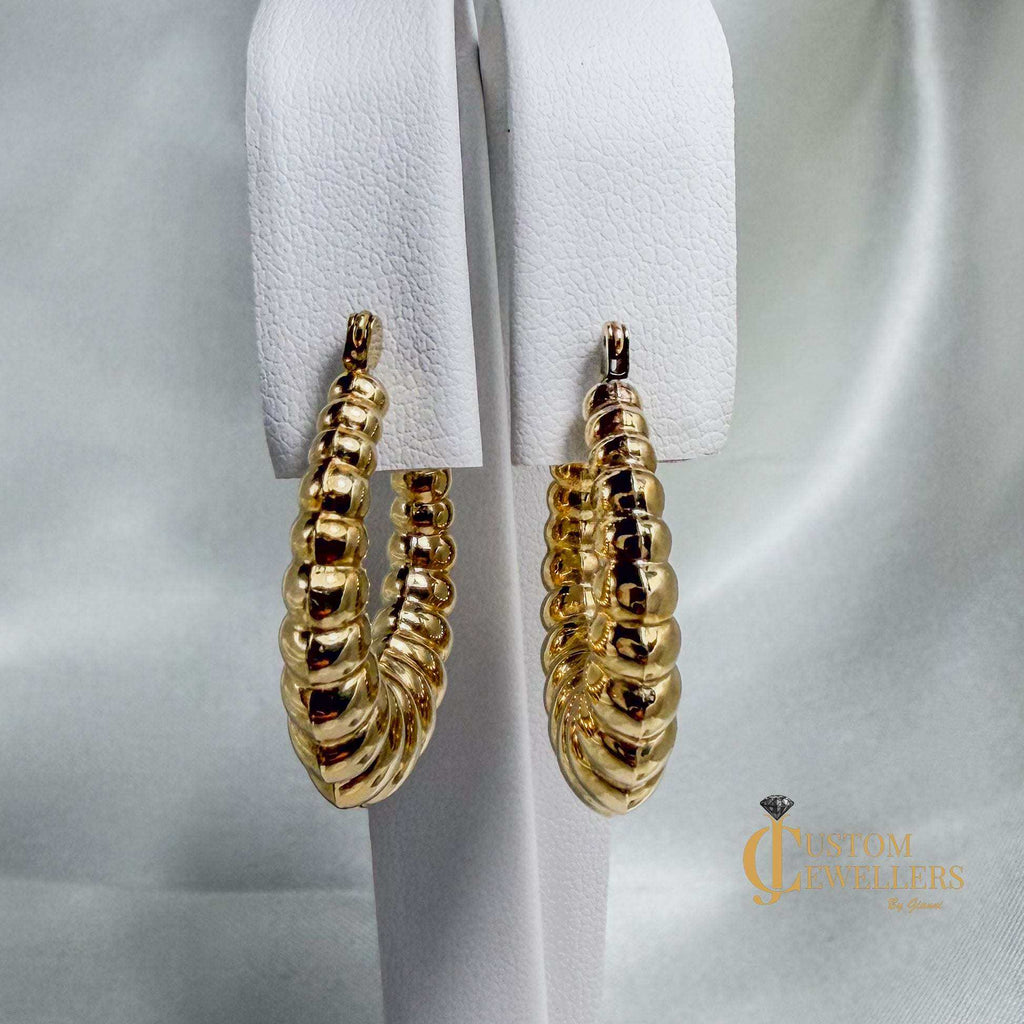 14kt yellow gold seashell-inspired oval hoop earrings with ripple design