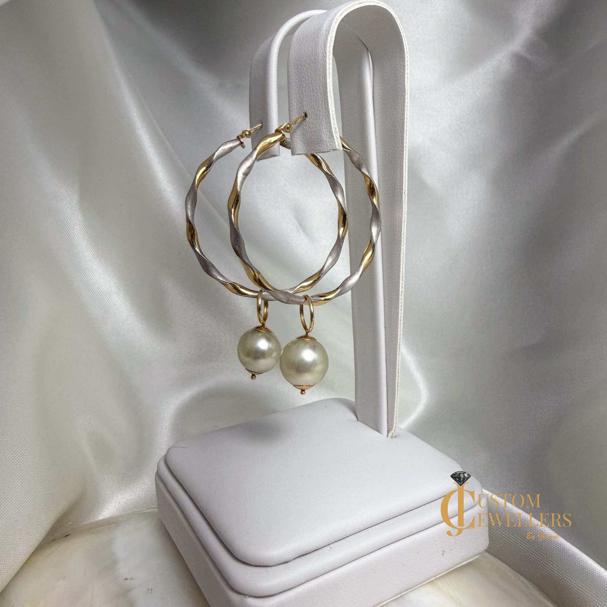 Two-tone white and yellow gold twist hoop pearl earrings with removable pearls